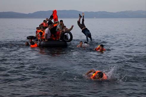Refugees arriving at the Greek island of Lesbos